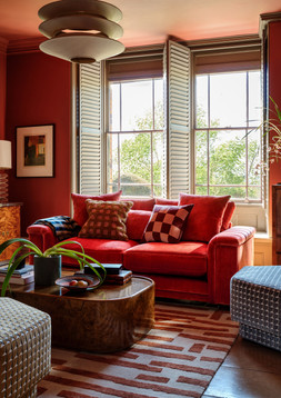Regency 2 Seater in Regency Fine Textured Chenille Deep Coral All Over with Distressed Walnut Feet and No Studs, £1699. Regency Designer Footstool in Regency Geometric Designer Fabric Copper, £449. Regency Designer Footstool in Regency Geometric Designer Fabric Sky, £449.
