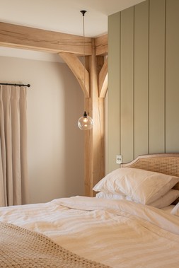 Skinny ribbed Hereford pendant light beside the bed