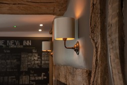 Classic wall light with silver silk shade at New Inn