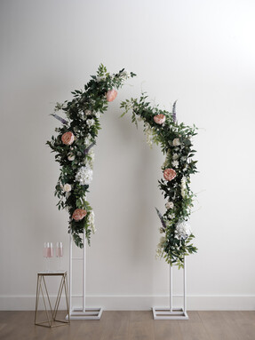 Create & Celebrate Split Archway - £60 Mini Pink Open Rose Wired Floral Picks 10 Pack - £2 Mini Cream Rose Wired Floral Picks 10 Pack - £2 Green Sword Fern 43cm - £5 Green Ficus Branch 60cm x 40cm - £2.50 White Two Head Wisteria 90cm - £5.50