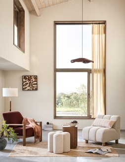 Rocco XL Shade £89 / Marlowe Floor Lamp £159 / Dempsey Armchair £299 / Faux Mohair Throw £22.50 / Cement Vase £29.50 / Form Footstool £99 / Dempsey Side Table £179 / Handkerchief Centrepiece £19.50 / Stripe Cushion £25 / Form Accent Chair £199 / Jute Diamond Rug from £99